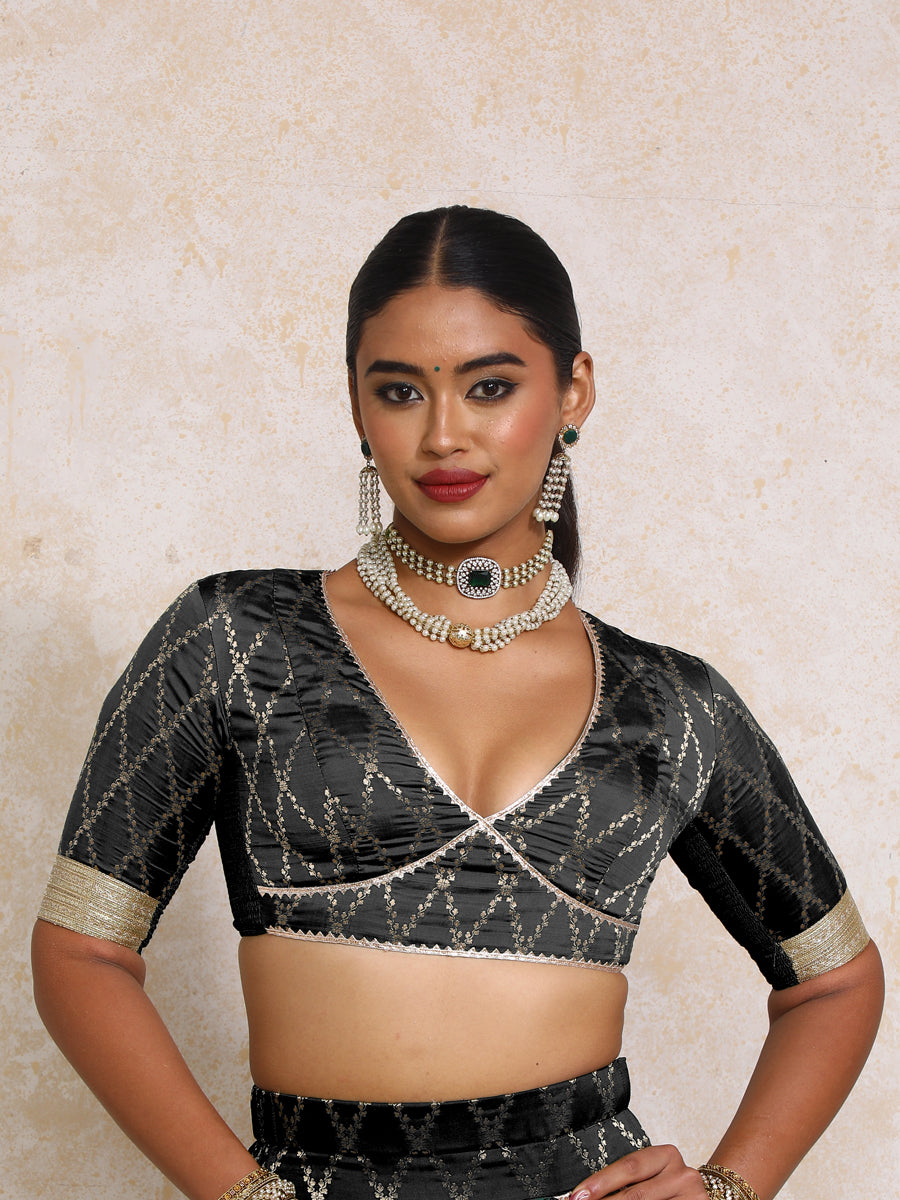 Rivya x Tyohaar Saree Blouse, in Black Viscose Silk Brocade, featuring elbow sleeves and v-neckline.