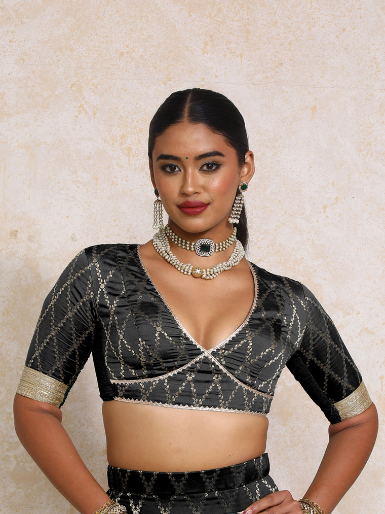 Rivya x Tyohaar Saree Blouse, in Black Viscose Silk Brocade, featuring elbow sleeves and v-neckline.