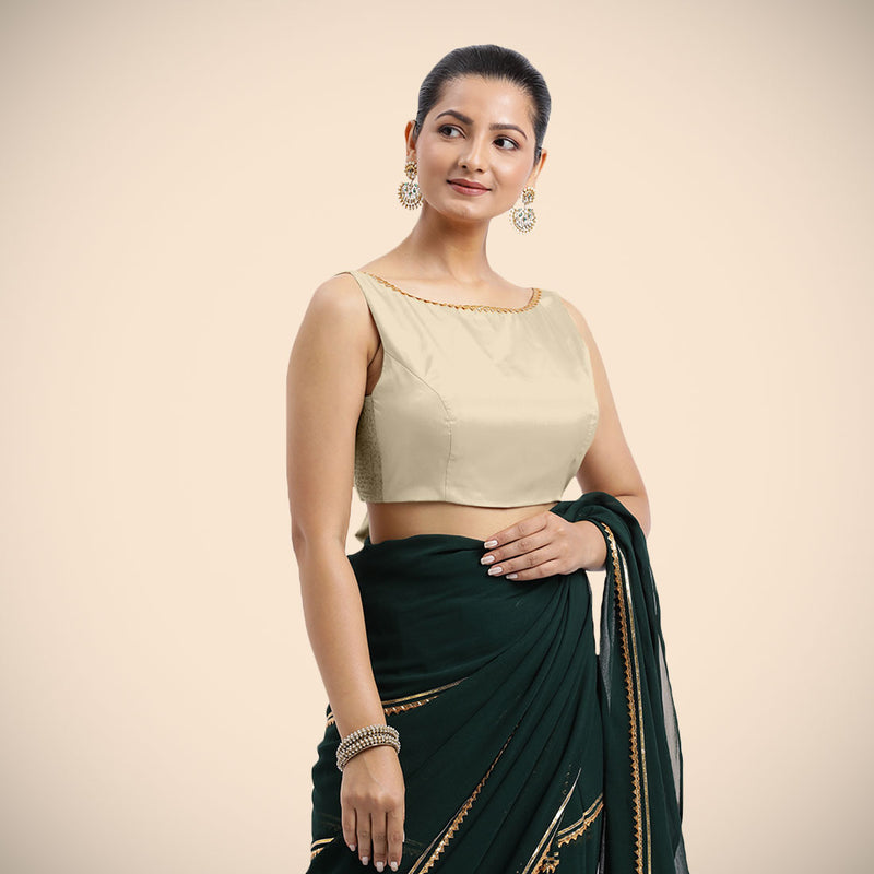 Sherry x Tyohaar | Cream Sleeveless FlexiFit™ Saree Blouse with Simple Golden Gota Lace on Neckline and Removable Bow on Back-Binks