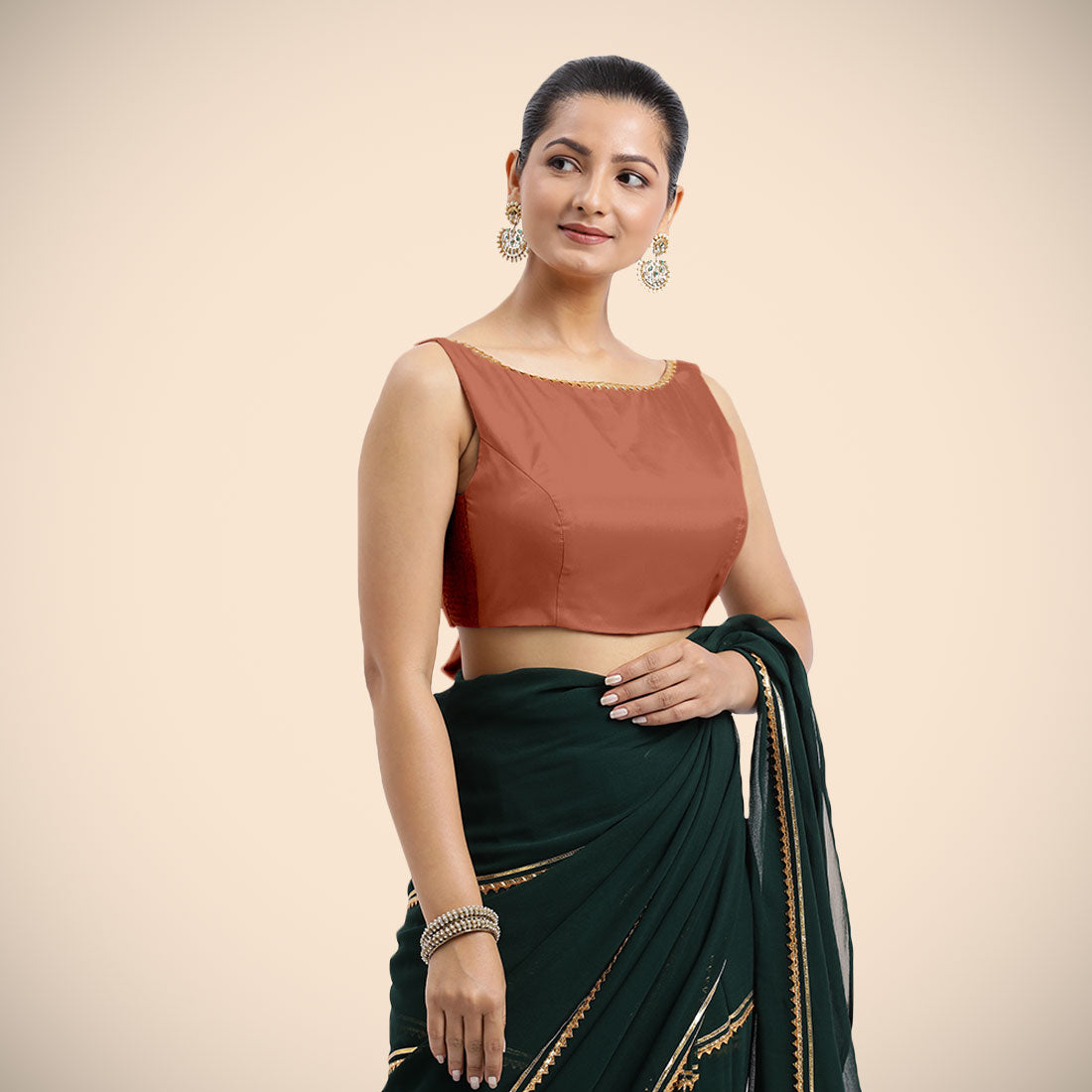 Sherry x Tyohaar Saree Blouse, in Copper Vegan Silk, featuring sleeveless and boat neckline, made for party & festive.