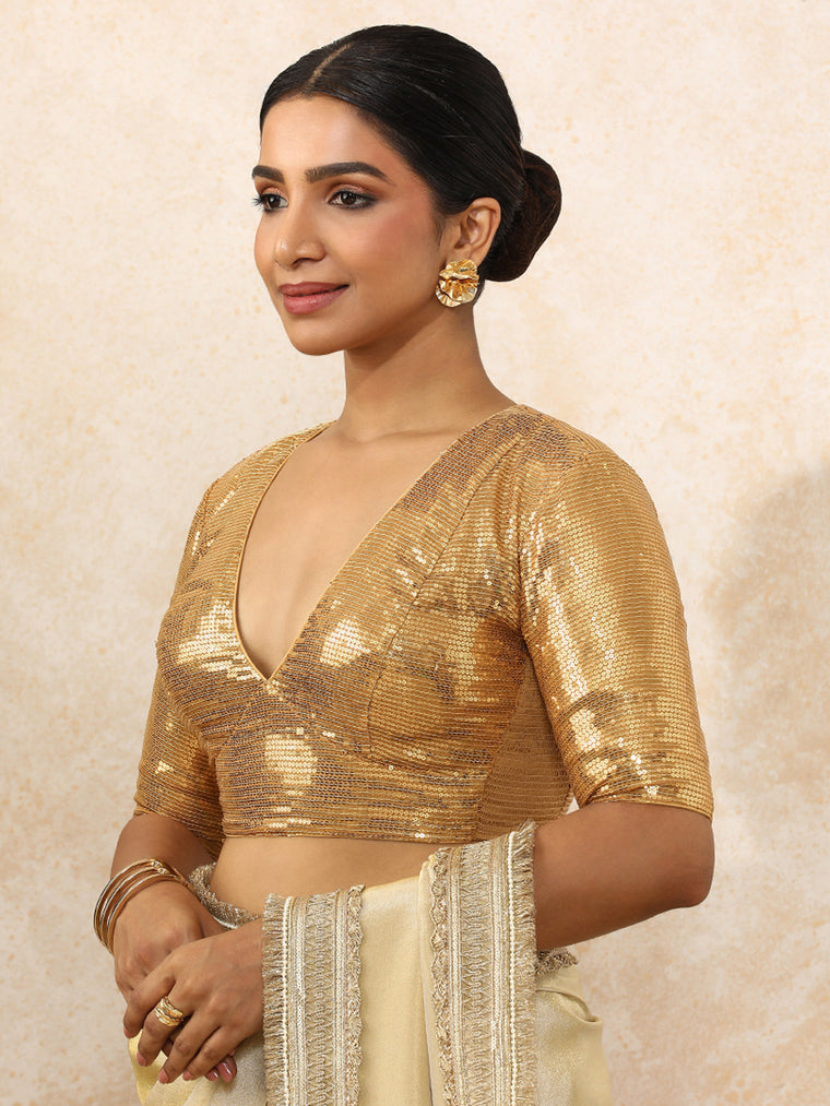 Shireen x Tyohaar Saree Blouse, in Gold Sequin Fabric, featuring elbow sleeves and v-neckline, made for party & festive.