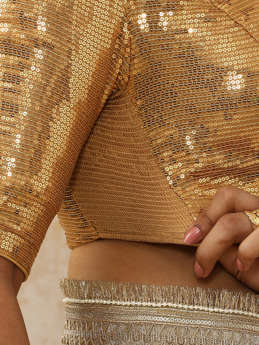 Shireen x Tyohaar Saree Blouse, in Gold Sequin Fabric, featuring elbow sleeves and v-neckline, made for party & festive.