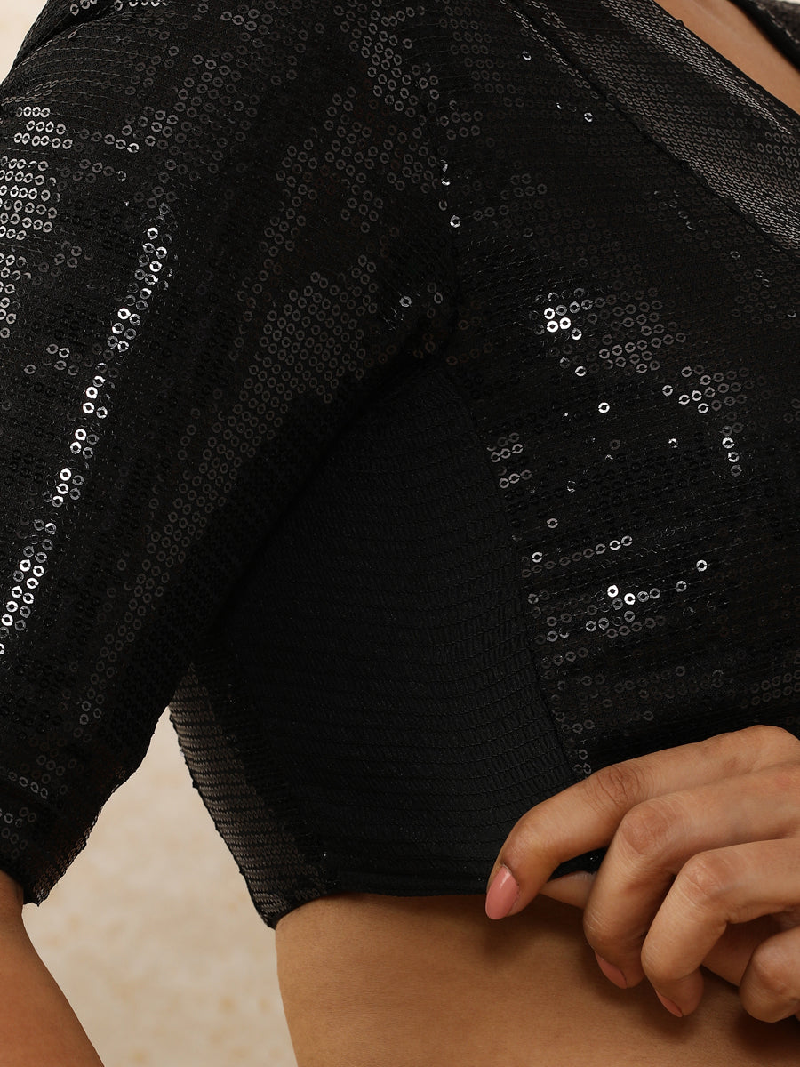 Sunidhi x Tyohaar Saree Blouse, in Black Sequin Fabric, featuring elbow sleeves and v-neckline, made for party & festive.