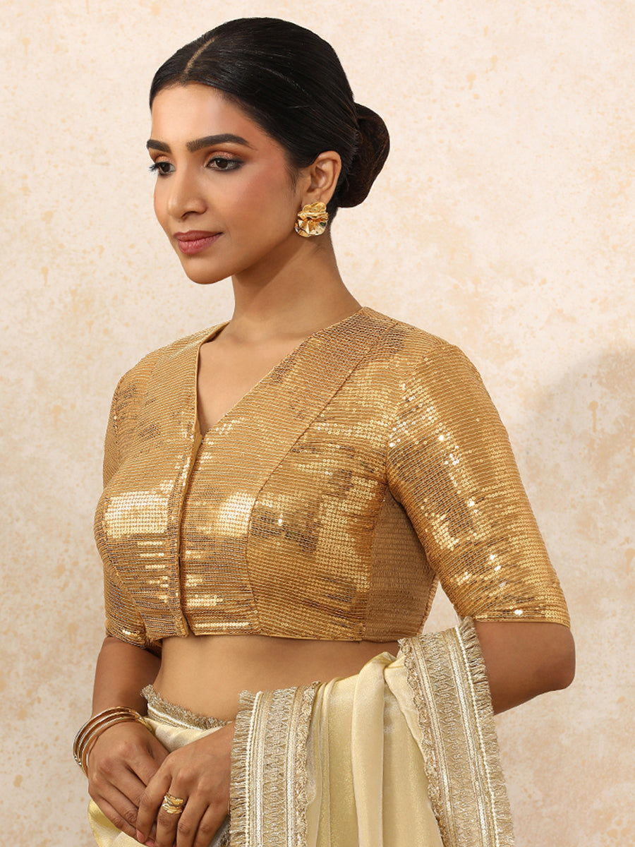 Sunidhi x Tyohaar Saree Blouse, in Gold Sequin Fabric, featuring elbow sleeves and v-neckline, made for party & festive.