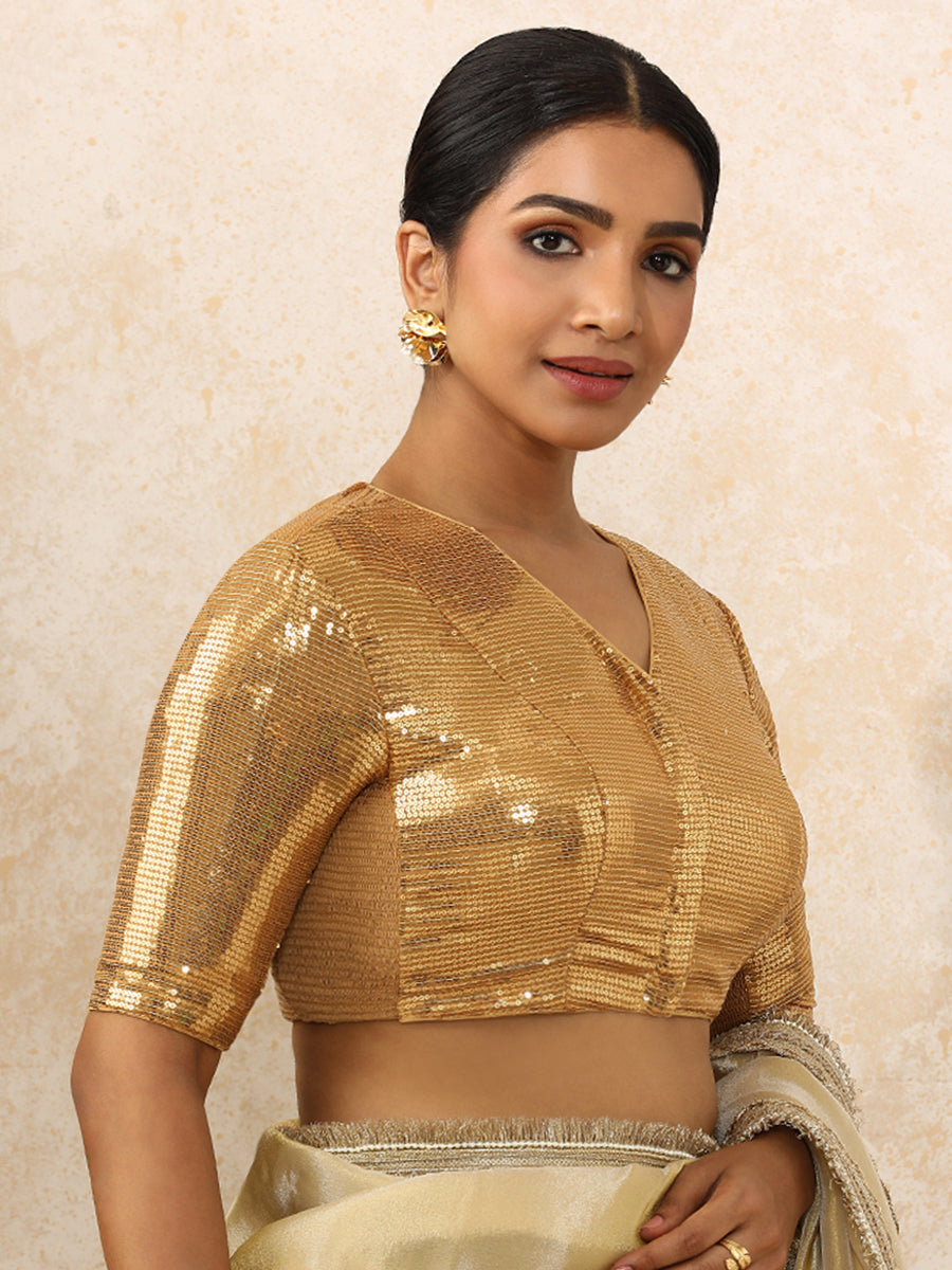 Sunidhi x Tyohaar Saree Blouse, in Gold Sequin Fabric, featuring elbow sleeves and v-neckline, made for party & festive.