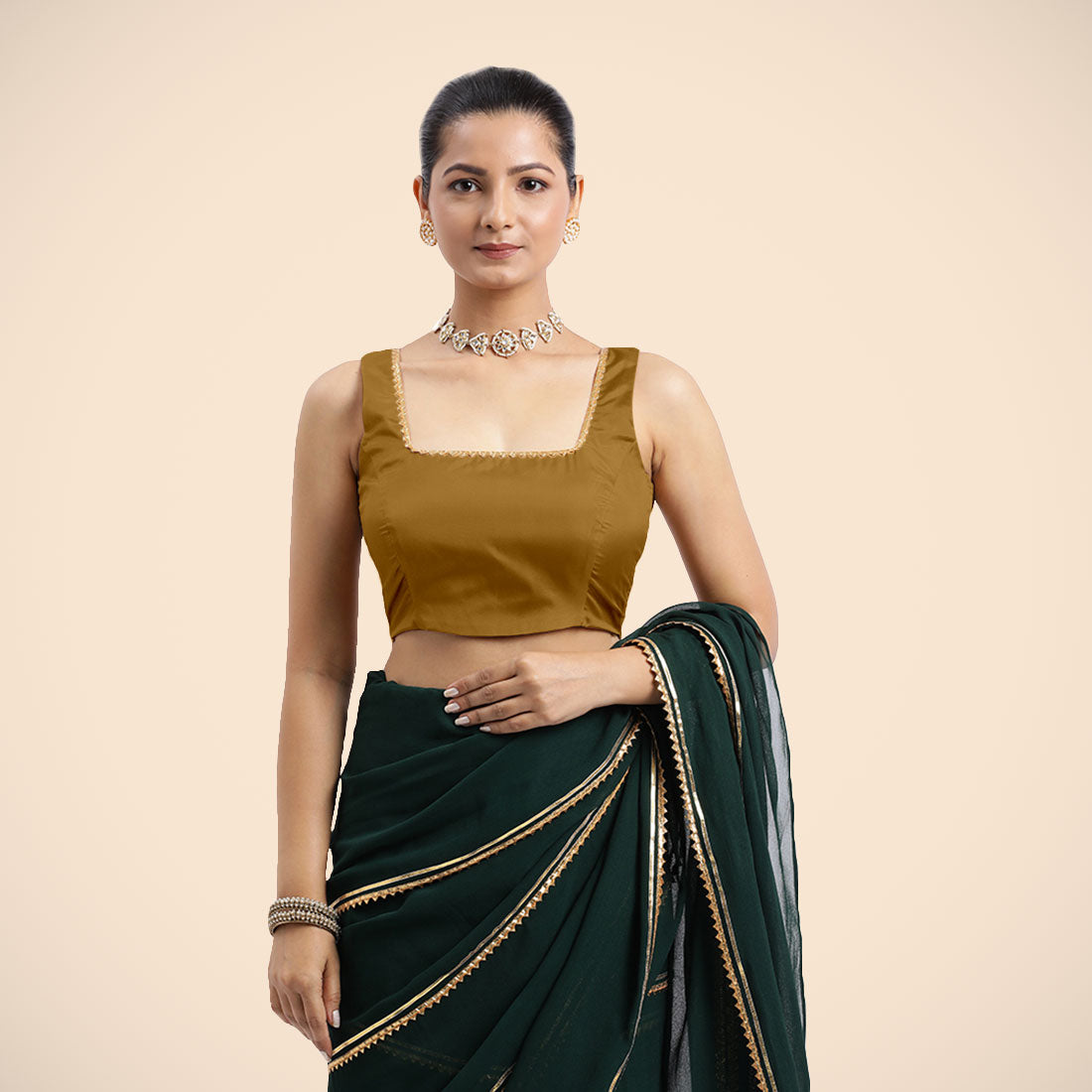Tanvi x Tyohaar Saree Blouse, in Gold Vegan Silk, featuring sleeveless and square neckline, made for party & festive.