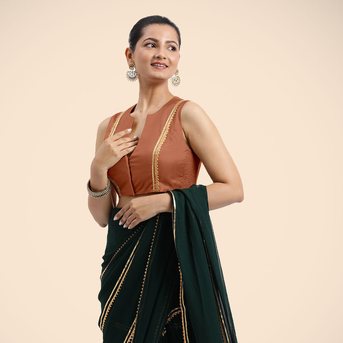 Veena x Tyohaar Saree Blouse, in Copper Vegan Silk, featuring sleeveless and curved v-neckline, made for party & festive.