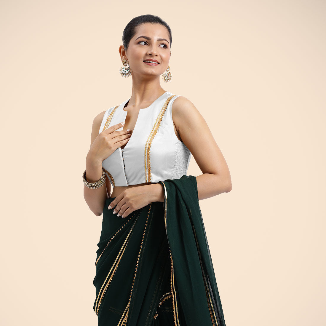 Veena x Tyohaar Saree Blouse, in White Vegan Silk, featuring sleeveless and curved v-neckline, made for party & festive.