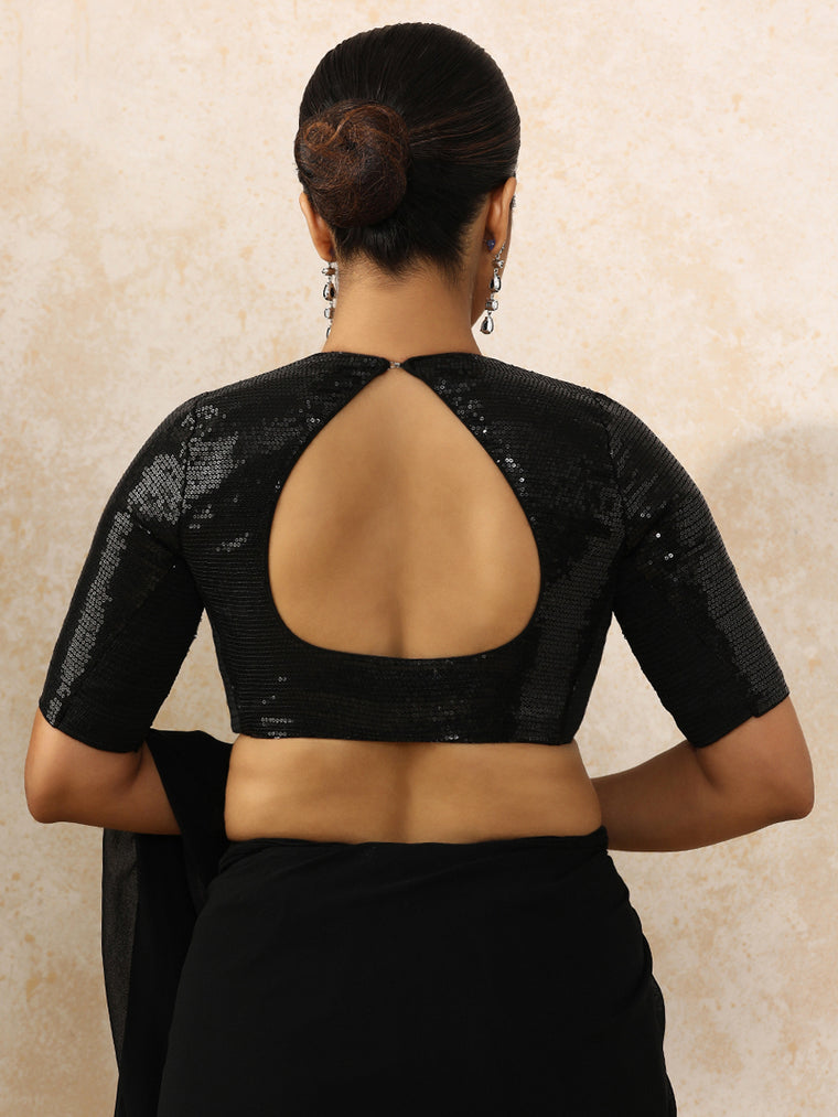 Yashvi x Tyohaar Saree Blouse, in Black Sequin Fabric, featuring elbow sleeves and pot neckline, made for party & festive.