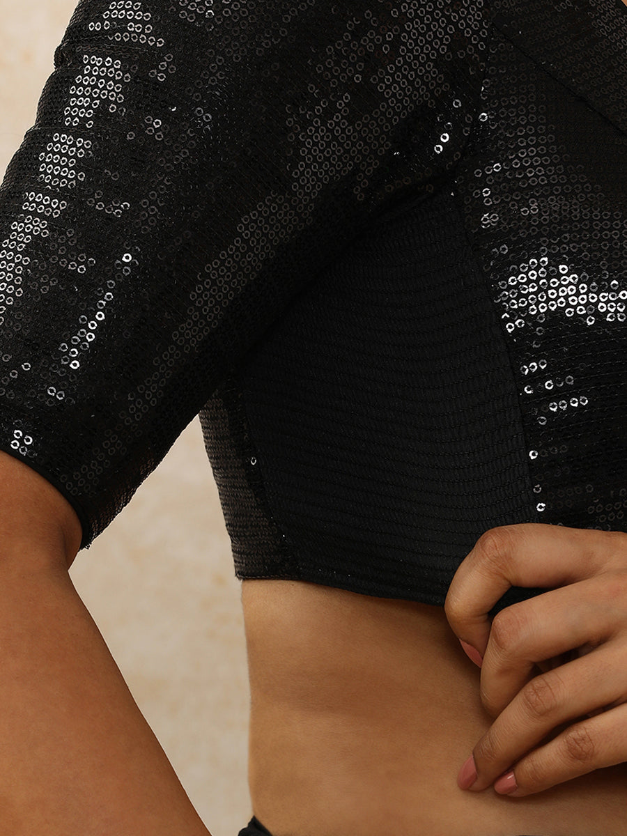 Yashvi x Tyohaar Saree Blouse, in Black Sequin Fabric, featuring elbow sleeves and pot neckline, made for party & festive.