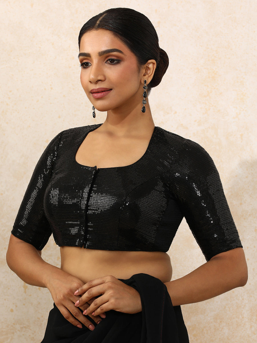 Yashvi x Tyohaar Saree Blouse, in Black Sequin Fabric, featuring elbow sleeves and pot neckline, made for party & festive.
