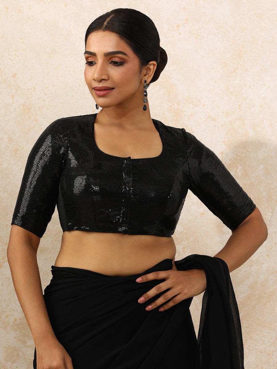 Yashvi x Tyohaar Saree Blouse, in Black Sequin Fabric, featuring elbow sleeves and pot neckline, made for party & festive.