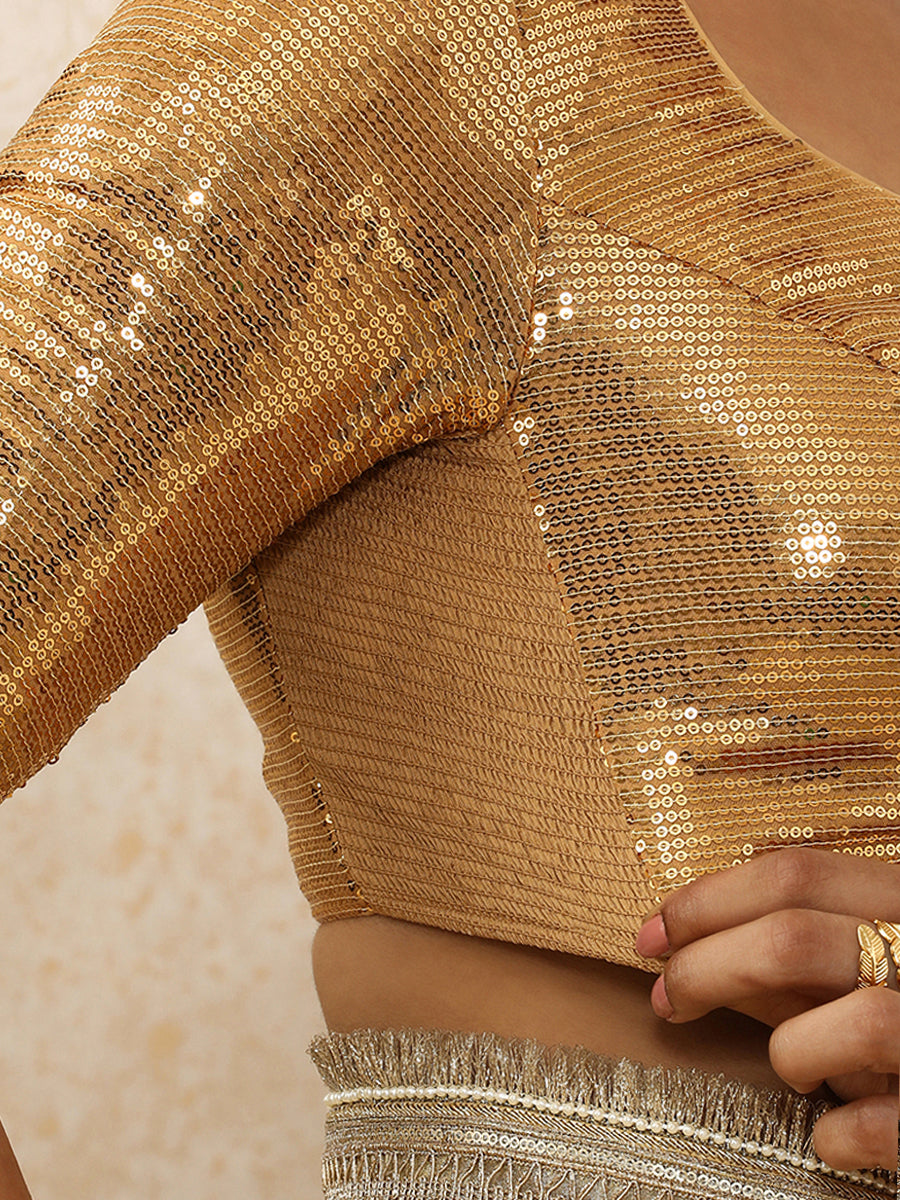 Yashvi x Tyohaar Saree Blouse, in Gold Sequin Fabric, featuring elbow sleeves and pot neckline, made for party & festive.