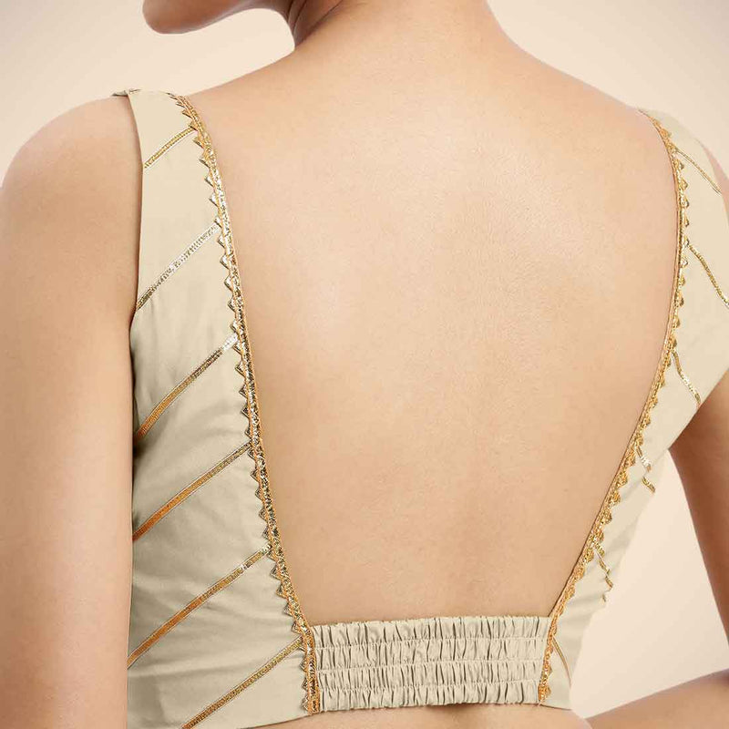 Zeba x Tyohaar | Cream Sleeveless FlexiFit™ Saree Blouse with Square Neck with Golden Gota Lace and Deep Back-Binks