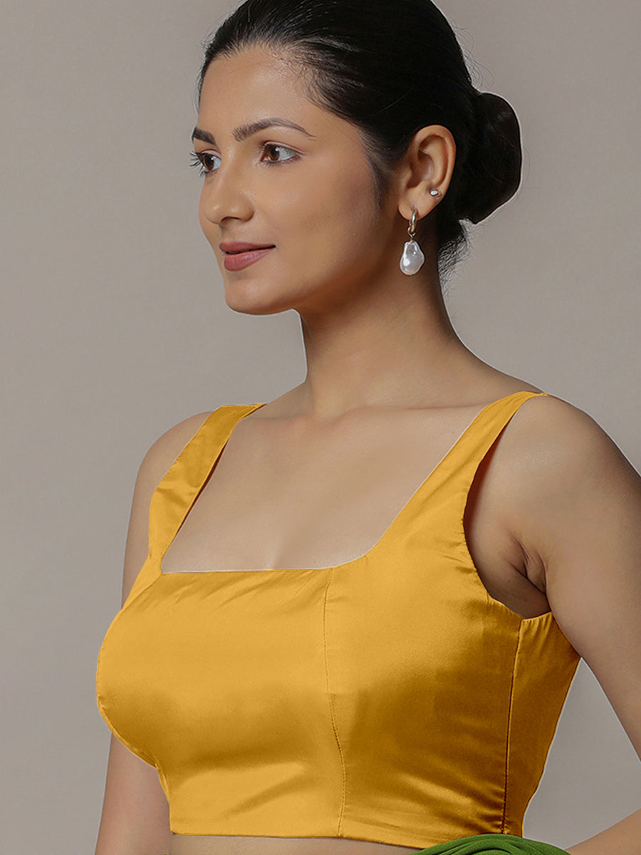 Zeba x Rozaana Saree Blouse, in Yellow Artificial Silk, featuring sleeveless and square neckline, made for party & festive.