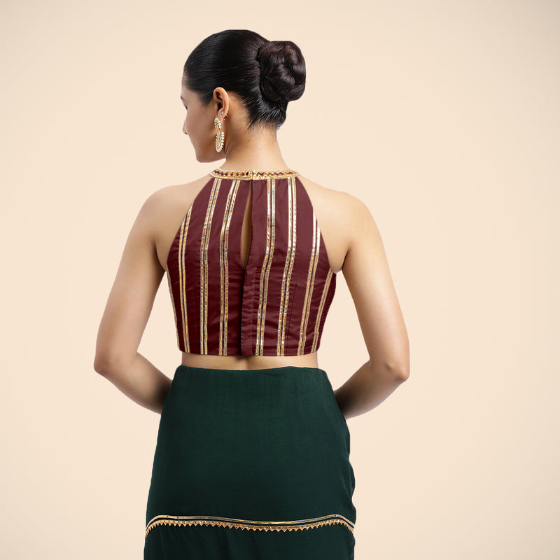 Zubeida x Tyohaar | Burgundy Halterneck FlexiFit™ Saree Blouse with Elegant Golden Gota Embellishment on Princess Line-Binks