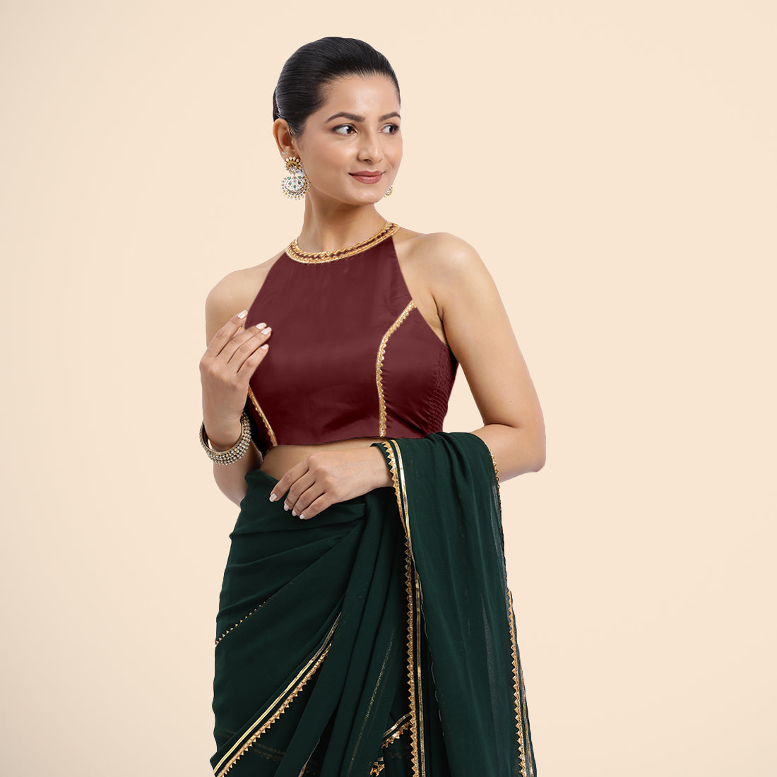 Zubeida x Tyohaar Saree Blouse, in Maroon Vegan Silk, featuring sleeveless and halter neckline, made for party & festive.