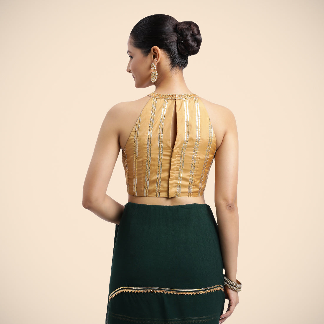 Zubeida x Tyohaar Saree Blouse, in Gold Vegan Silk, featuring sleeveless and halter neckline, made for party & festive (view 4).
