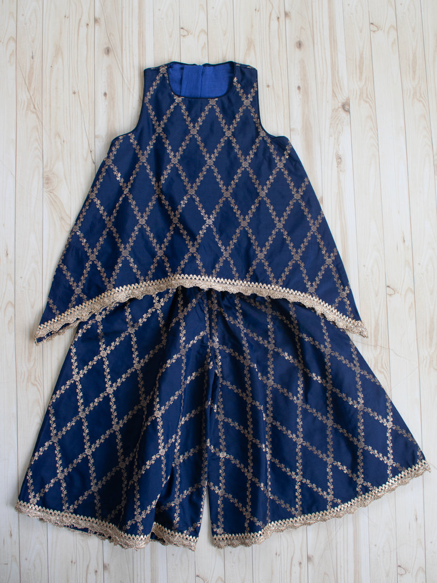 Poppy x Tyohaar Kidswear - Girls, in Blue Viscose Silk Brocade, featuring sleeveless and jewel neckline.