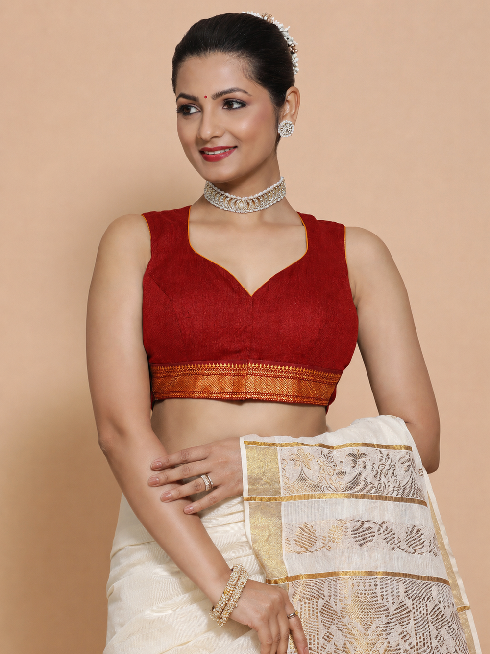 Kasavu-Kit Kasavu Saree with Varsha Sleeveless blouse in Chilli Red Mangalgiri